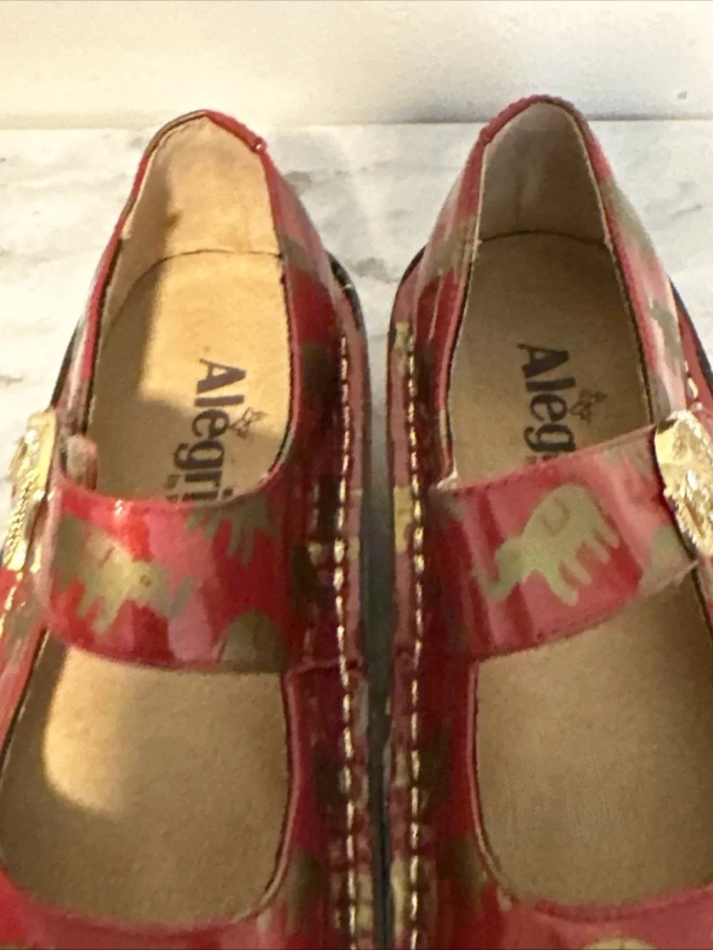 Alegria patent Red leather Mary Jane Platforms with Gold Elephant Accents
